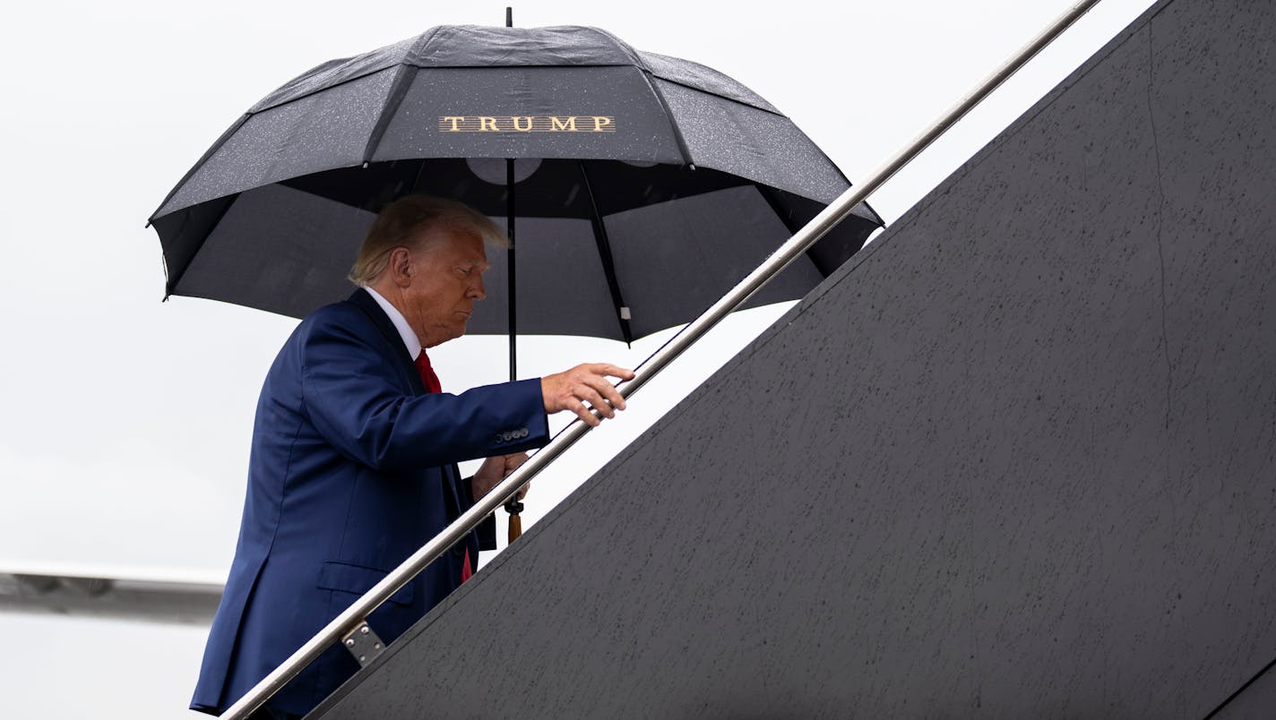 FILE — Former President Donald Trump departs Reagan National Airport after his arraignment in federal court in Washington on Thursday, Aug. 3, 2023. Two prominent conservative law professors have concluded that Trump is ineligible to be president under a provision of the Constitution that bars people who have engaged in an insurrection from holding government office.