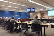 St. Croix County supervisors debate a resolution to pause refugee resettlement Tuesday night in Hudson, Wis.