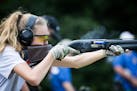 Ear protection is a must, and from a young age. Here, Samantha Stark, 14, of the Wayzata High School Trap Team, shot trap Aug. 9, 2016, during a frien