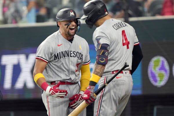 Royce Lewis celebrated his home run that scored three runs with teammate Carlos Correa (4) during the fifth inning against the Rangers on Sunday. Lewi