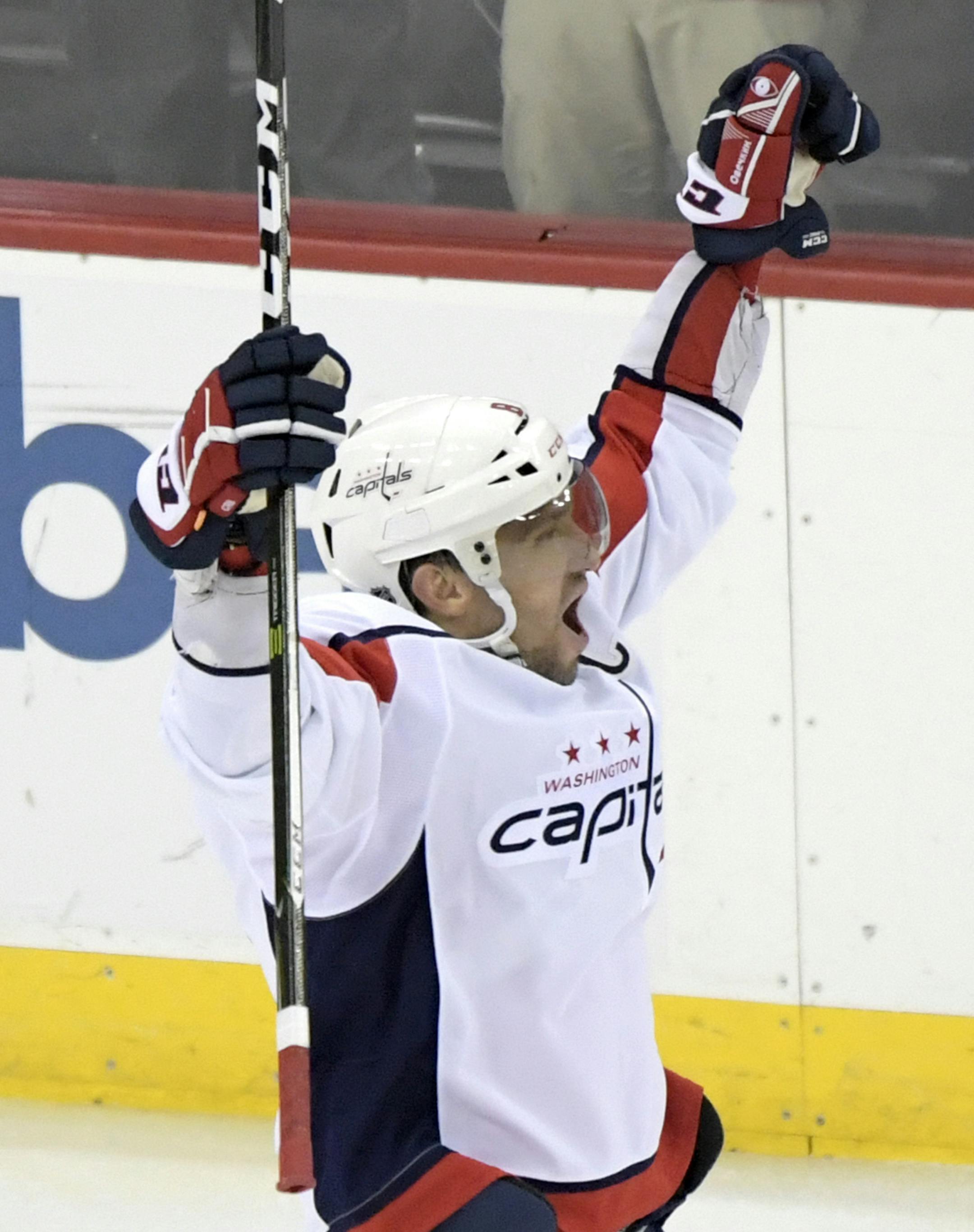 Washington Capitals left wing Alex Ovechkin (8) celebrates his 700th career goal during the third period of an NHL hockey game against the New Jersey Devils Saturday, Feb. 22, 2020, in Newark, N.J. (AP Photo/Bill Kostroun)