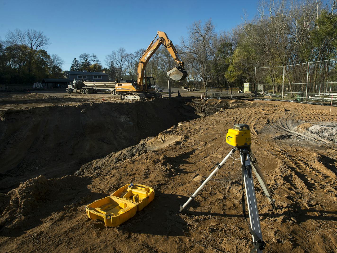 A hole was dug at Upper Villa Park that will soon be filled with a cistern used to store rain water and irrigate the ball field. ] (AARON LAVINSKY/STAR TRIBUNE) aaron.lavinsky@startribune.com Runoff polluted with lawn chemicals and road salt pour into McCarrons Lake fueling algae growth that chokes other plants and wildlife. A new project will soon divert as much as 1.3 million gallons of that runoff from the lake. Rainwater will be captured, filtered and used to water the playing fields at Uppe