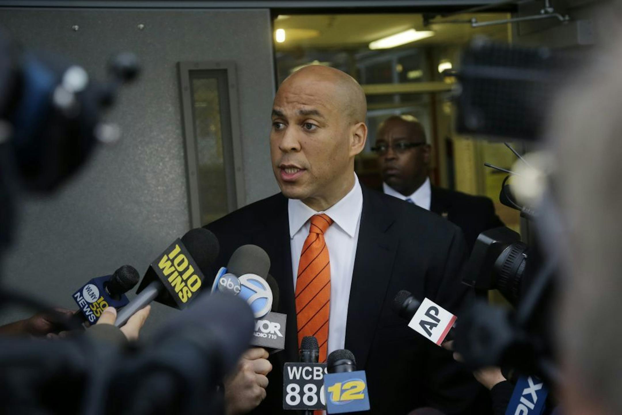 Newark Mayor and Senate candidate Cory Booker answers a question after he voted in a primary election Tuesday, Aug. 13, 2013, in Newark, N.J.