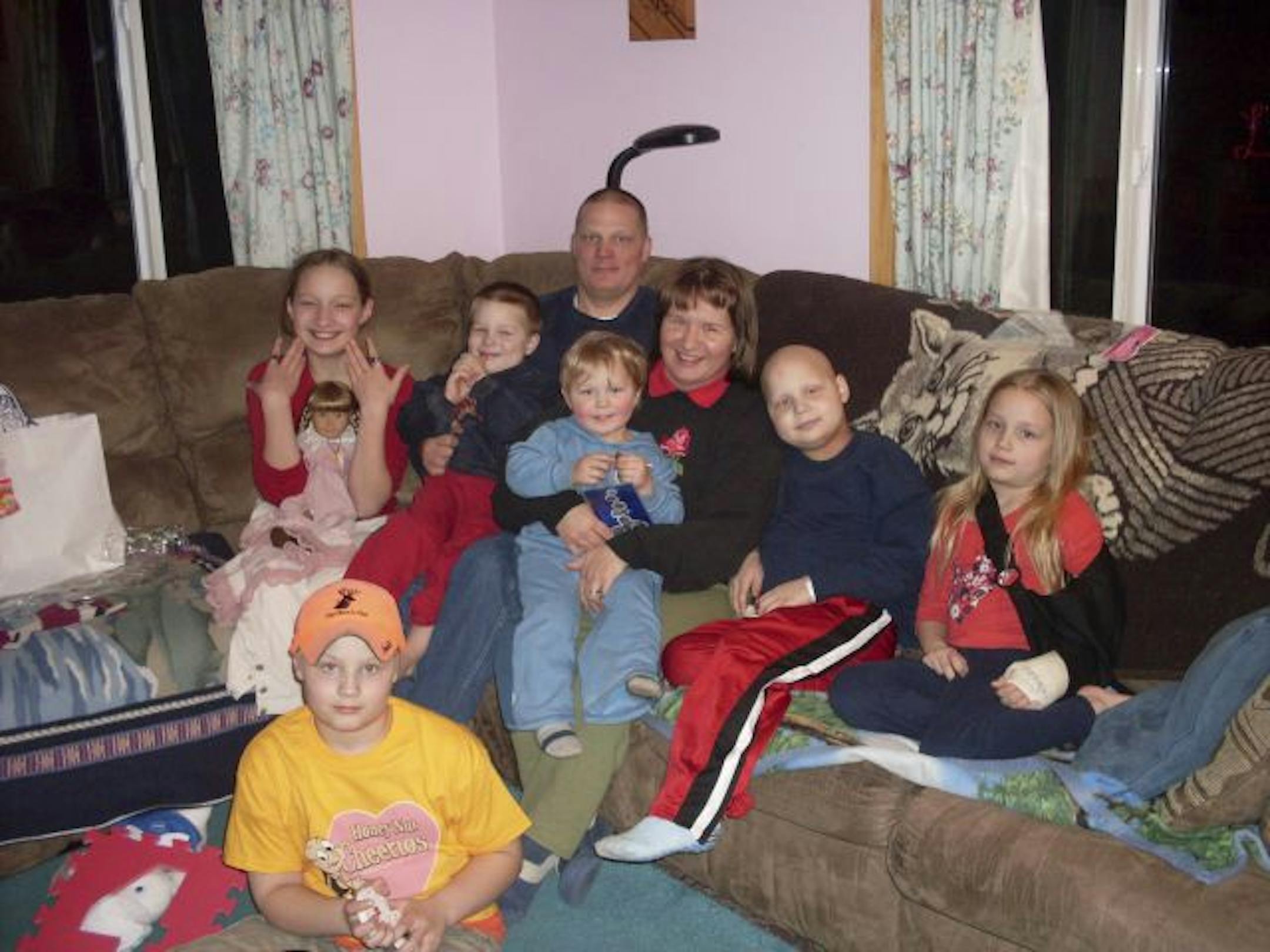 The Bisila family lost AJ, second from right, last spring. His parents, Lisa and Tom Bisila, and his siblings, from left Susan, 13, Michael, 11, Marc, 5, Waylyn, 3, and Julee, 8, will get a vacation at Disney World thanks to Megan Millmann. She knows from experience how tough cancer is on families.