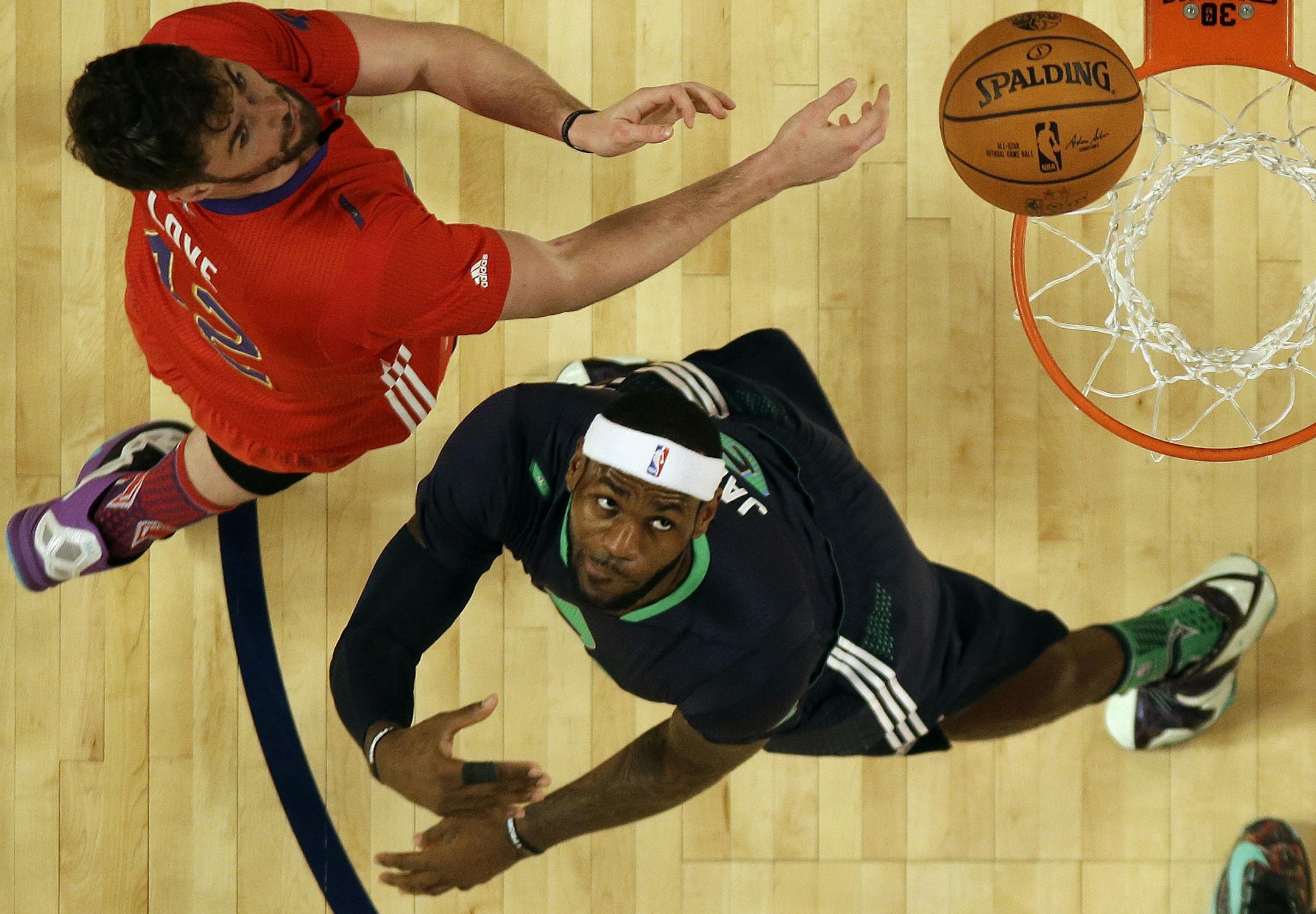 West Team's Kevin Love, of the Minnesota Timberwolves (42) defends against East Team's LeBron James, of the Miami Heat (6) during the NBA All Star basketball game, Sunday, Feb. 16, 2014, in New Orleans. (AP Photo/Gerald Herbert)
