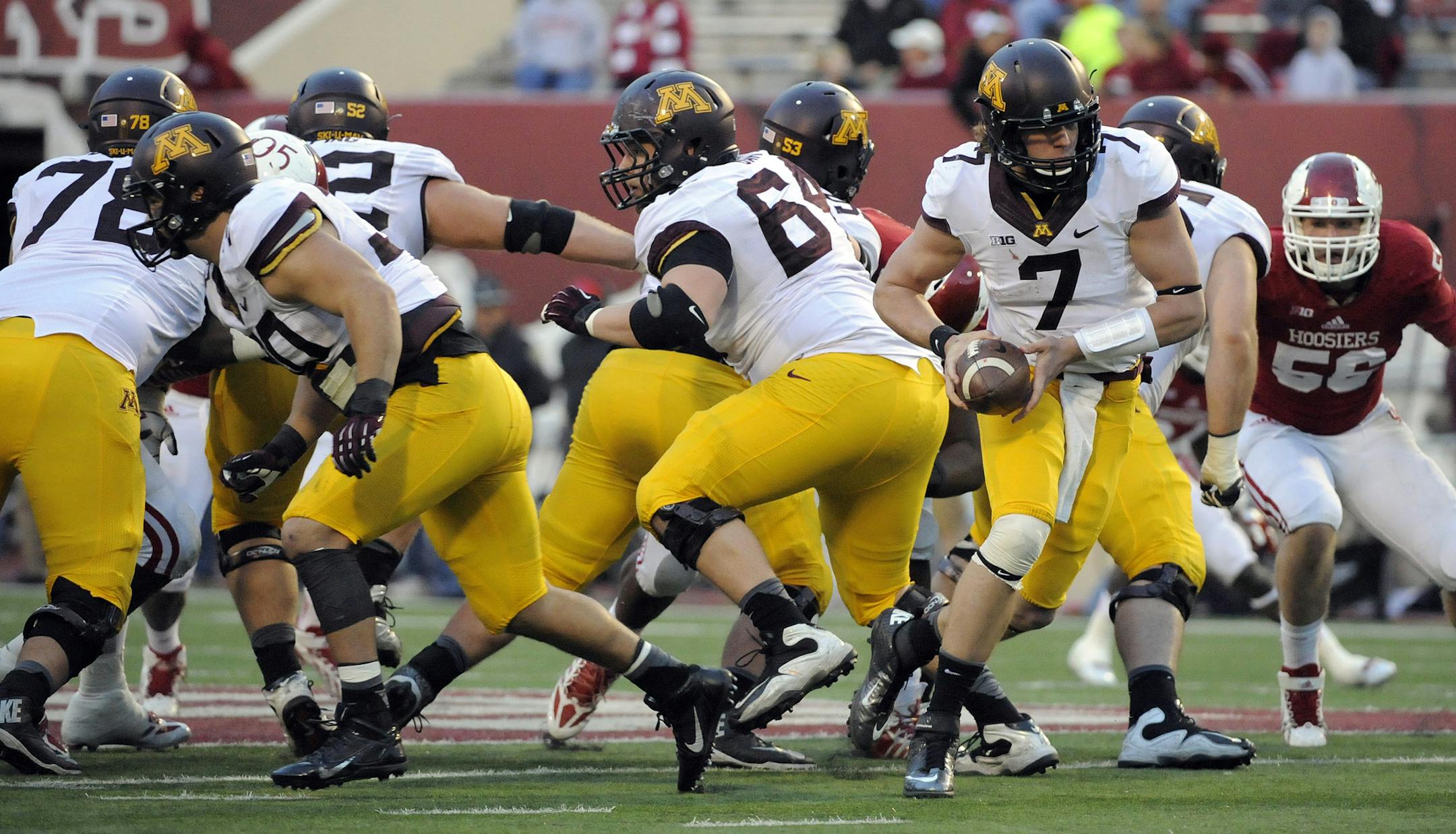 Minnesota's Damarius Travis (7) looks for the handoff during the second half of an NCAA college football game against Indiana in Bloomington, Ind., Saturday, Nov. 2, 2013. Minnesota won 42-39(AP Photo/ Alan Petersime)