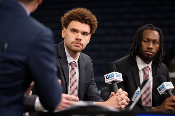 Former Gophers forward Jamison Battle, left, joined new Ohio State teammate Bruce Thornton on Tuesday for an interview during Big Ten media day at Tar