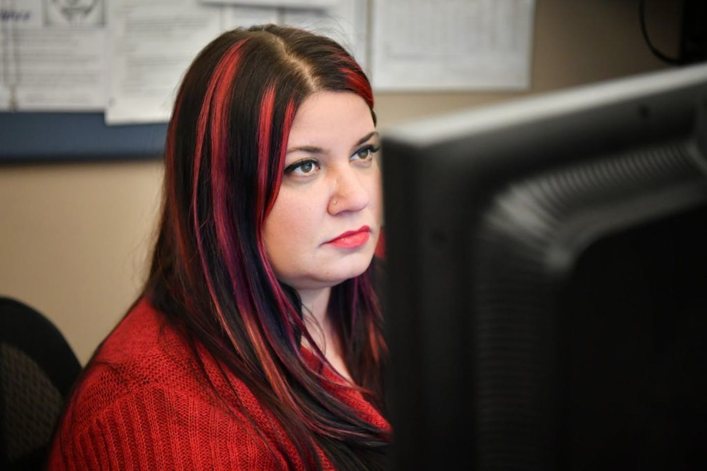 Rachel Bell handled calls to the MNsure call center in St. Paul on Friday. Insurance advisers are burning the midnight oil in advance of Tuesday's launch of open enrollment in the state's individual market.