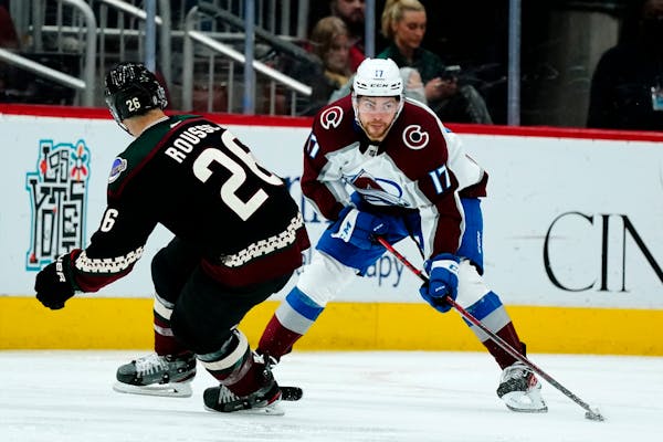 Tyson Jost, right, was traded by the Avalanche to the Wild