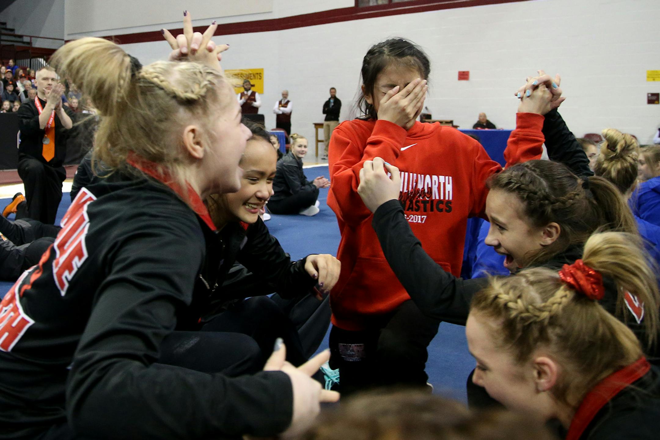 Lakeville North team members are overcome with joy after learning they had won the Minnesota State High School 2A gymnastics team championship Friday, Feb. 24, 2017, at the University of Minnesota in Minneapolis, MN. St. Cloud Tech, left, finished second.] DAVID JOLES &#x2022; david.joles@startribune.com 2A gymnastics team championship.