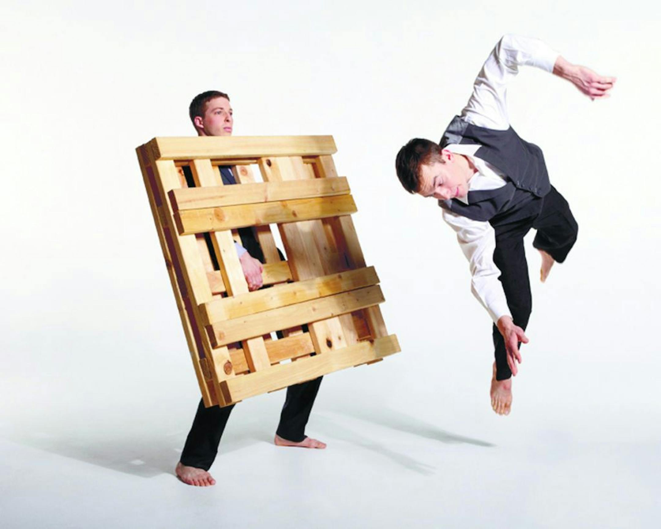 "huddle" by Arena Dances with dancers Jacob Melczer and Timmy Wagner (white shirt and vest, jumping) Photo by Jake Armour