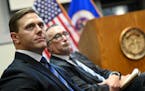 Sanford CEO Bill Gassen, left, and Fairview CEO James Hereford listen to public comments on Tuesday, Jan. 10, 2023.