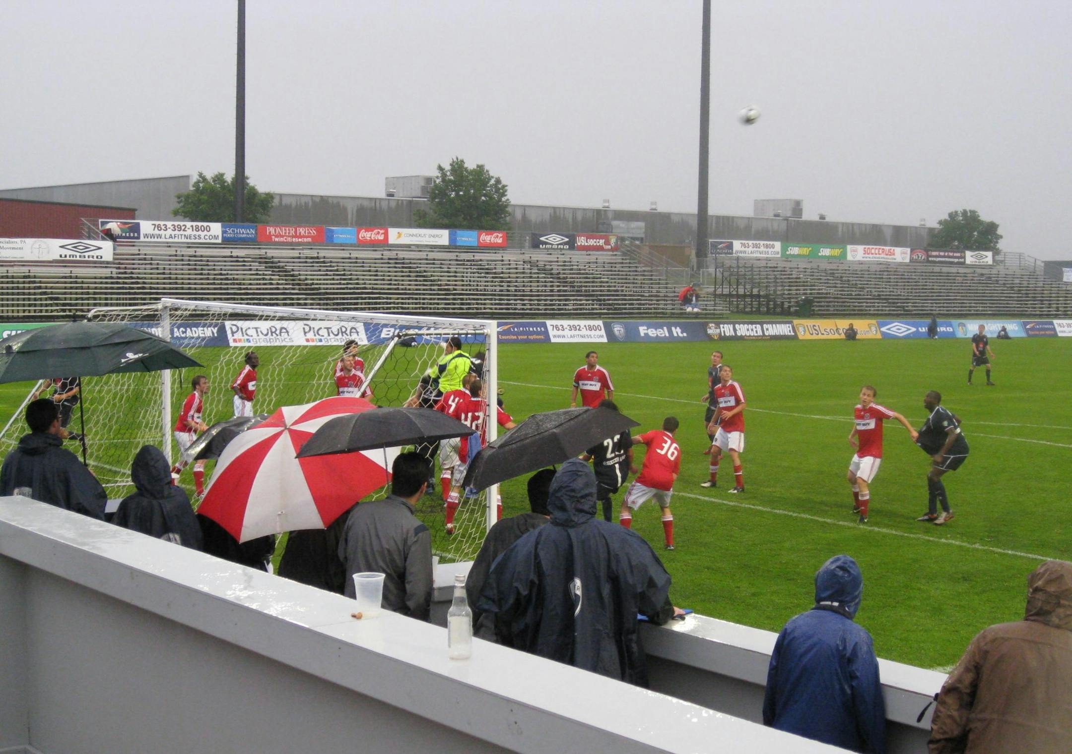 Fans in the Thunder Lounge beer garden tried to stay dry under umbrellas with the action right in front of them.