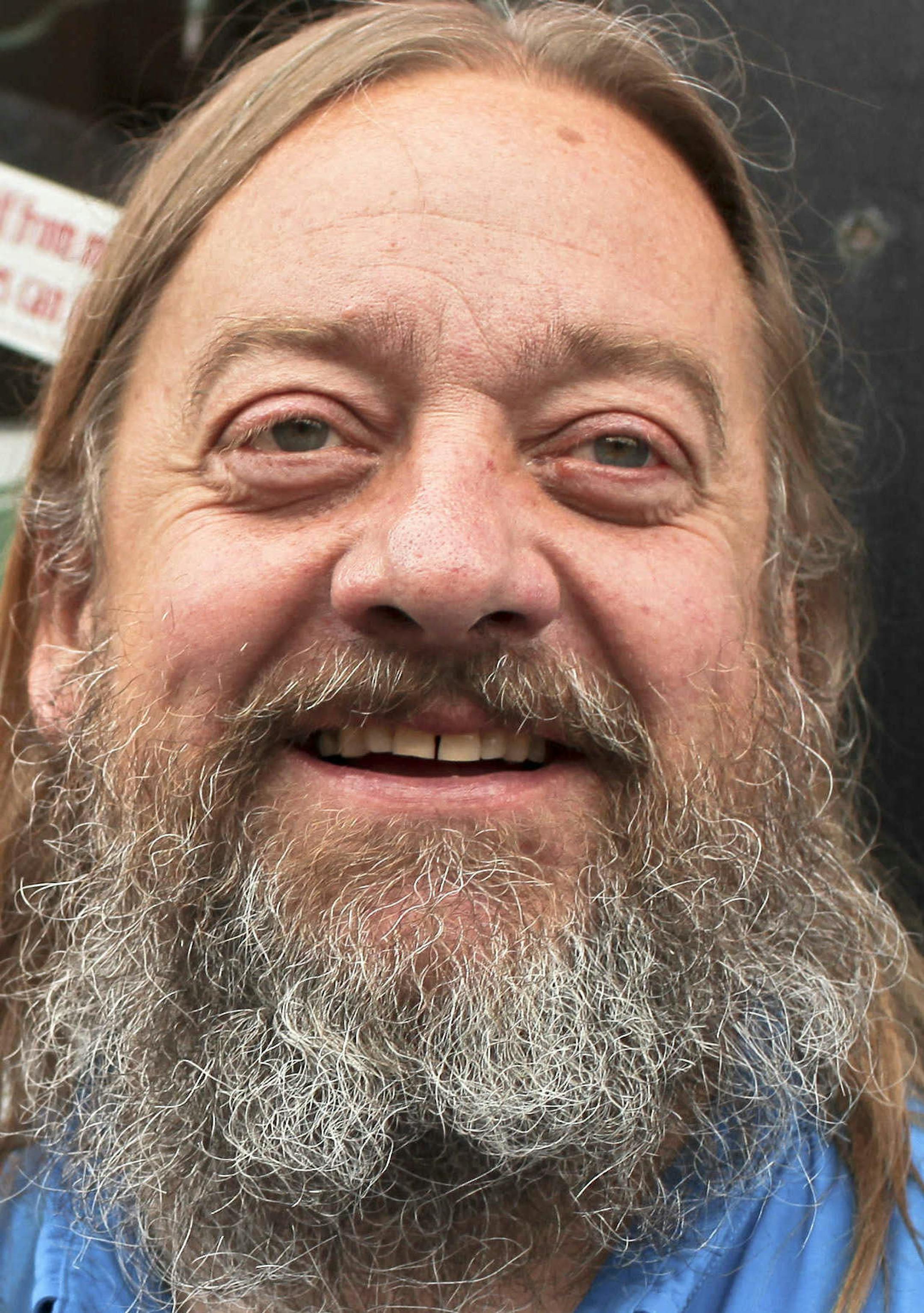 In this Aug. 28, 2013, file photo Jim Carlson stands outside his head shop, Last Place on Earth, in Duluth, Minn. Carlson doesnít dispute that he openly sold a lot of synthetic marijuana before authorities shut him down in July, but he insists he ran a legal business, selling legal products. His federal trial that starts Tuesday, Sept. 19, is one of the first major trials targeting a head shop and is expected to test how effectively authorities can combat synthetic drugs. (AP Photo/The Dulu