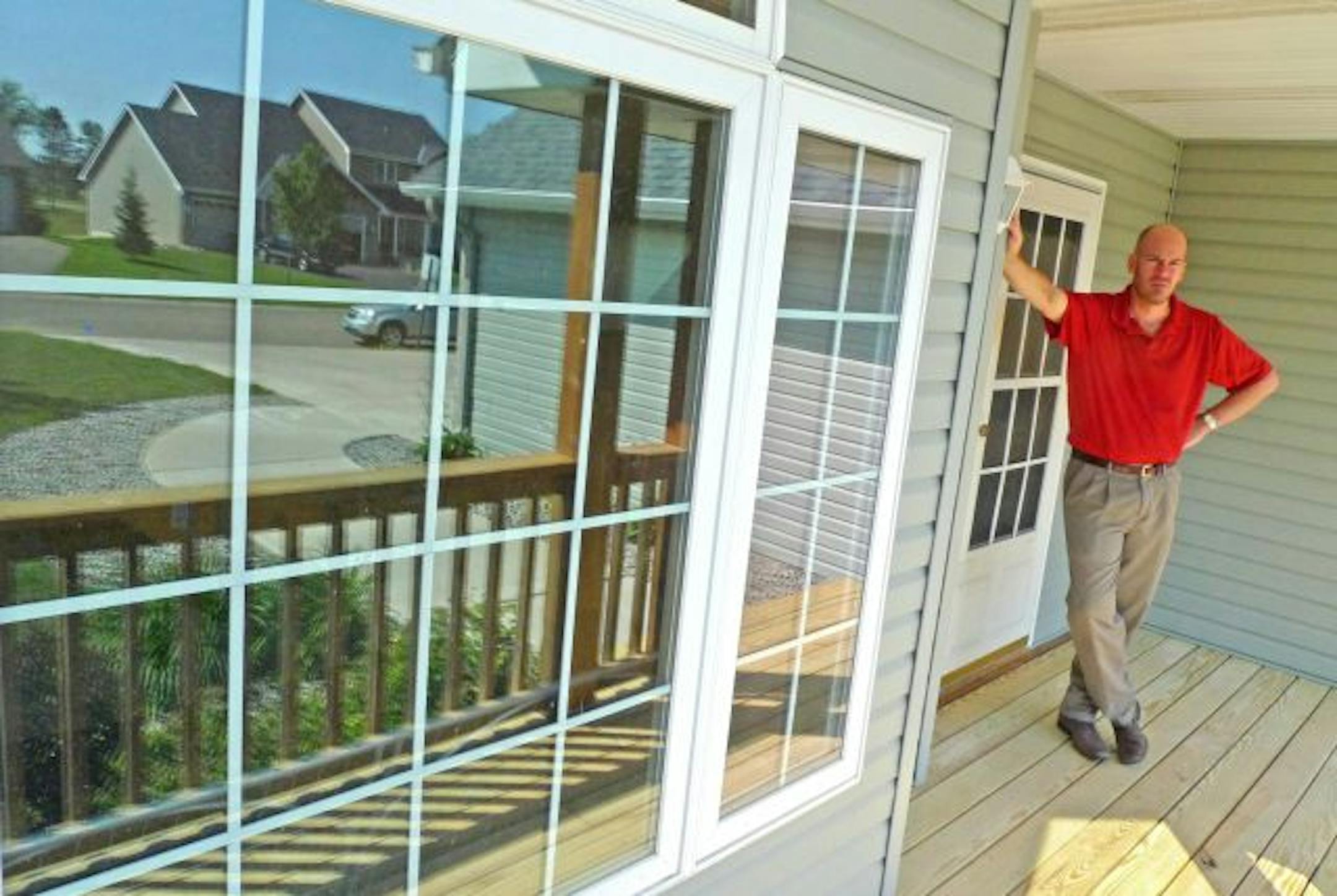 Christopher Onken, president, Zumbro House, Inc., stands on the front porch of the home at 1689 Hunter' Trail that Zumbro House wanted to be a group home for four teenage boys with developmental and mental disabilities. The neighborhood opposed the plan.