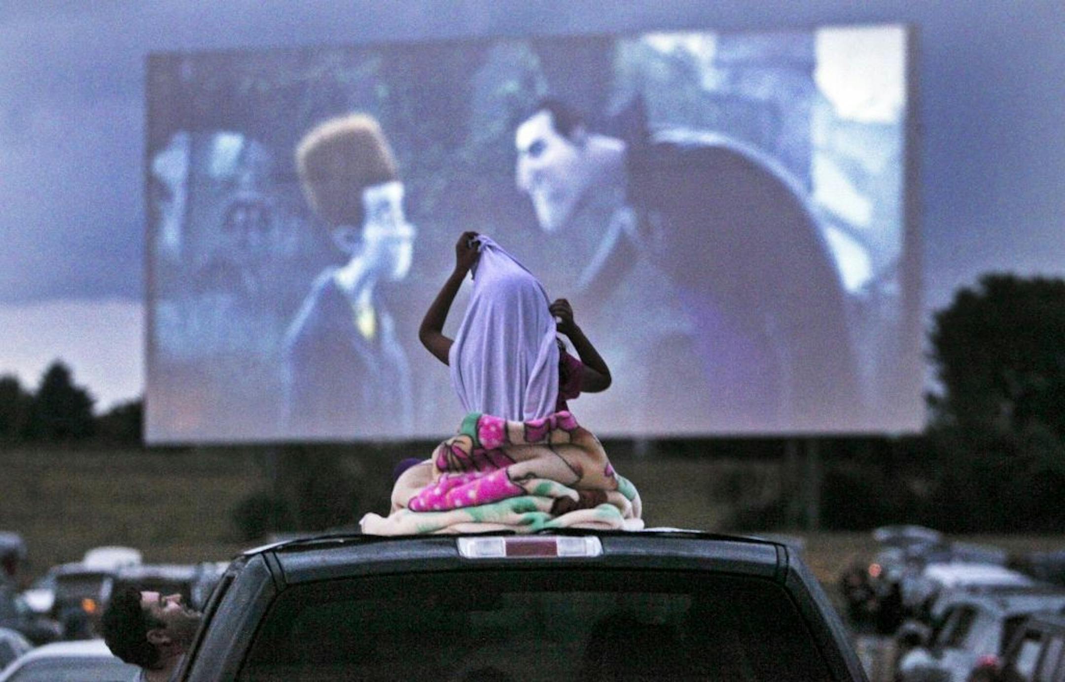 A young movie viewer settled in for a double feature on a warm night in July. On the marquee? "Ice Age: Continental Drift" and "Brave."