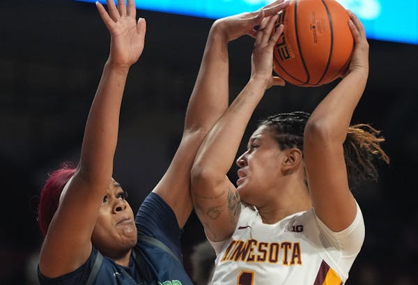 Gophers center Ayianna Johnson (1) battled inside against Chicago State’s Taylor Norris in Sunday’s game at Williams Arena.