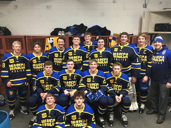 Waseca Bluejays wearing a jersery honoring wounded police officer Arik Matson.
