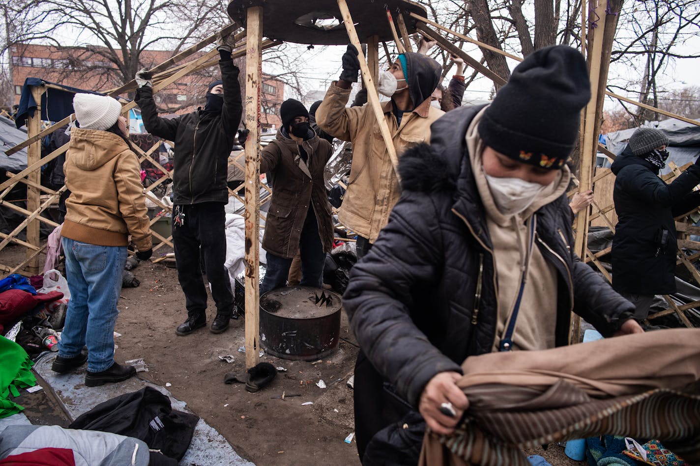 Volunteer and residents pack up a yurt to leave ahead of the shutdown of Camp Nenookaasi in Minneapolis, Minn., on Thursday, Jan. 4, 2024. The City of Minneapolis is planning to clear out the large homeless encampment over public safety and health concerns. ] RICHARD TSONG-TAATARII • richard.tsong-taatarii @startribune.com