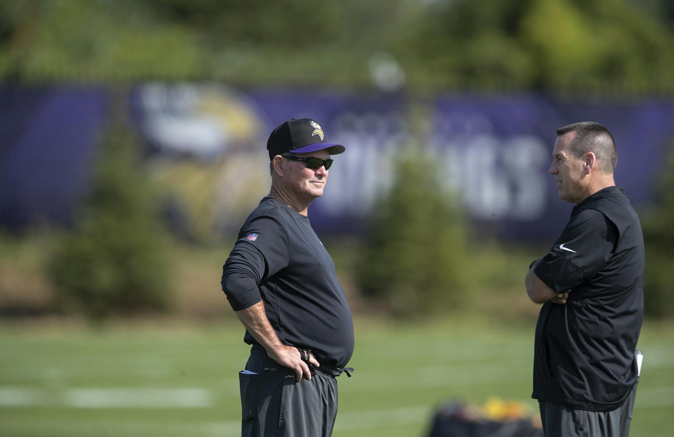 Vikings head coach Mike Zimmer left, and Gary Kubiak talked during the first day of training for Vikings rookies at TCO Performance Center July,23 2019 in Eagan, MN.