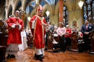 The Most Rev. Christopher J. Coyne, archbishop of Hartford, walks in a procession during a Pentecost Vigil at Blessed Michael McGivney Parish in St. M