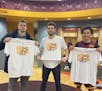 Gophers players (from left to right) Parker Fox, Jamison Battle, and Sean Sutherlin showed off “Homegrown” shirts in the locker room.