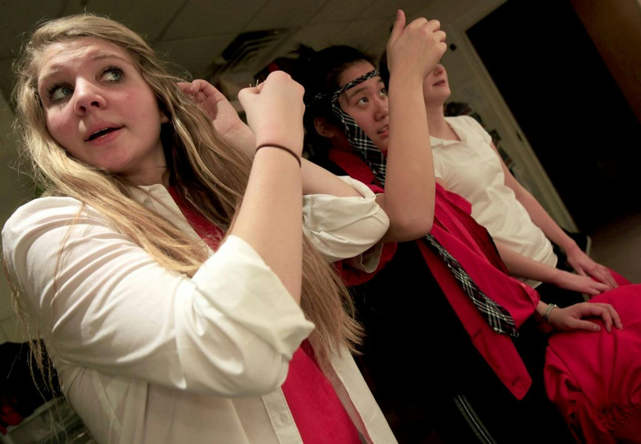 Actors get dressed for their rehersal at Visitation High School who are putting on a play at school in conjunction with Interact Center for the Arts, a theater company that helps disabled people perform. Mendota Heights, MN on January 30, 2013.