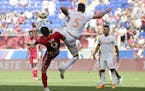 Atlanta United defender Leandro Gonzalez Pirez, center, jumps to kick the ball away from New York Red Bulls midfielder Andreas Ivan during the second 