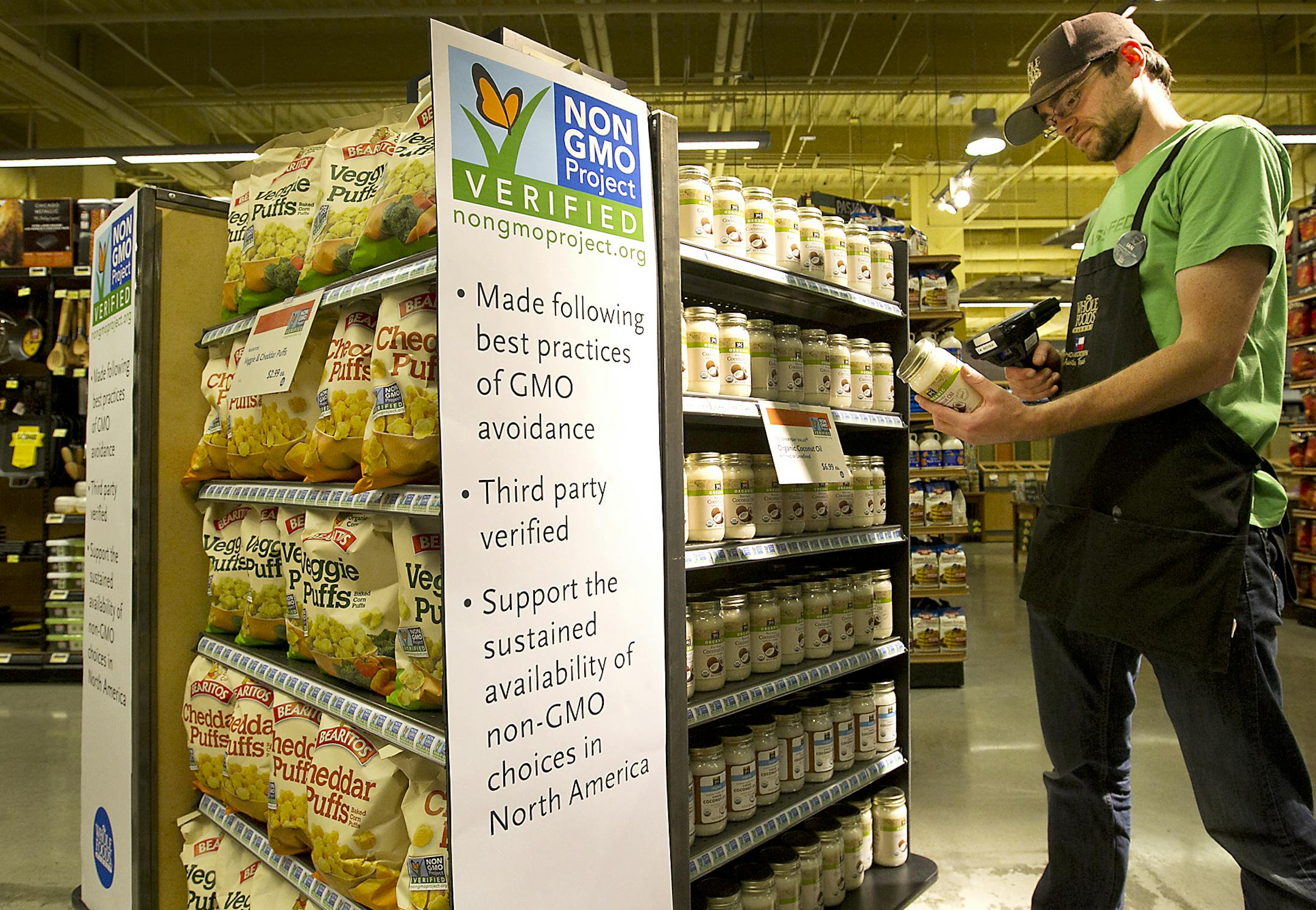 Whole Foods Market believes consumers have the right to know how their food is produced and this includes whether or not it contains Genetically Modified Organisms or GMOs. Here, store employee Ian Purdue scans non-GMO products for ordering at the 6th St. and Lamar downtown store in Austin, Texas, April 10, 2013. (Ralph Barrera/Austin American-Statesman/MCT)