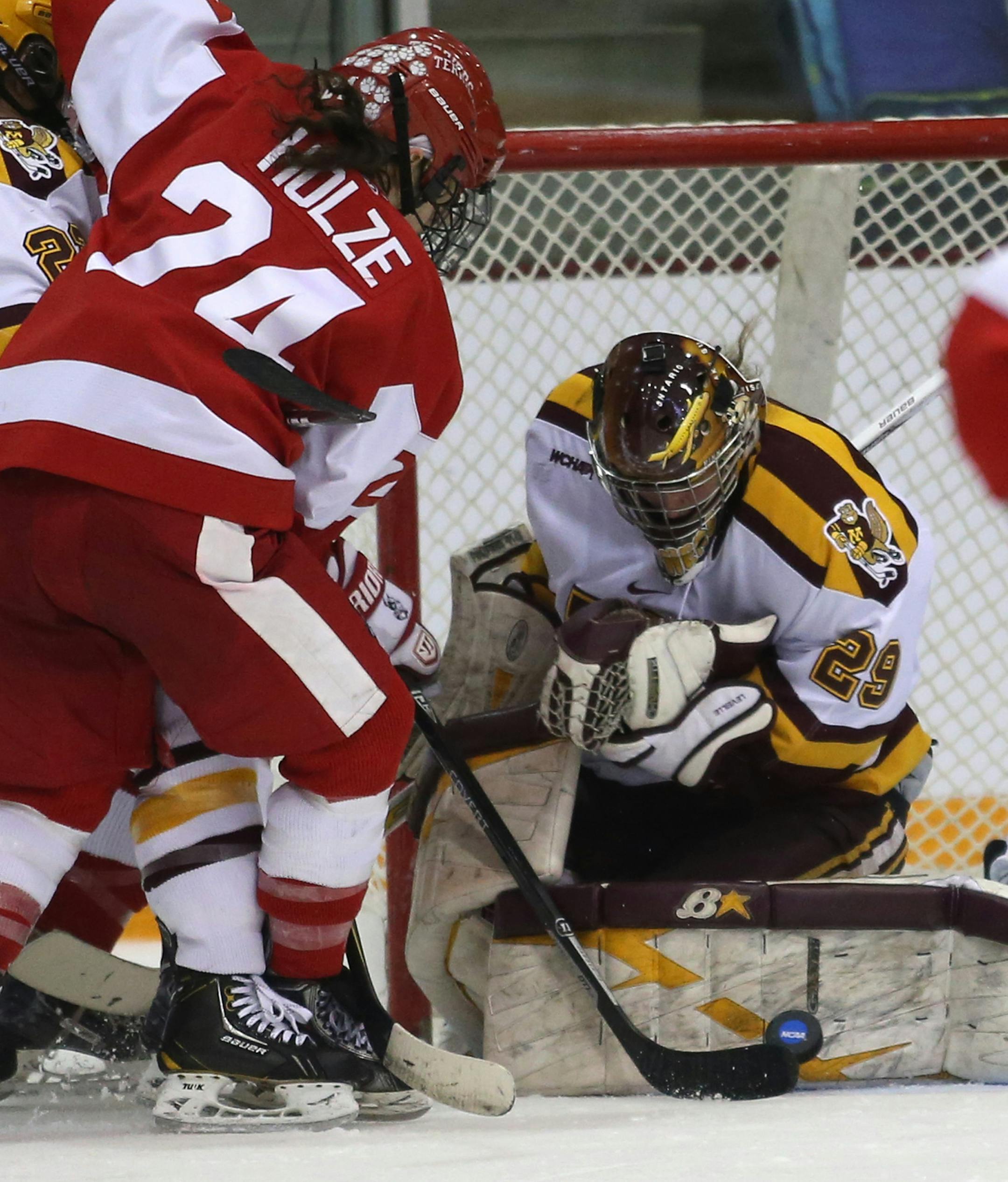 Gopher goalie Amanda Leveille blocked the shot of Boston University Taylor Holze during the third period. ] (KYNDELL HARKNESS/STAR TRIBUNE) kyndell.harkness@startribune.com Gopher women's hockey played Boston University in the quarterfinals of the NCAA championship at Ridder Arena in Minneapolis, Min, Saturday March 15, 2014. Gophers won over Boston University 5-1.