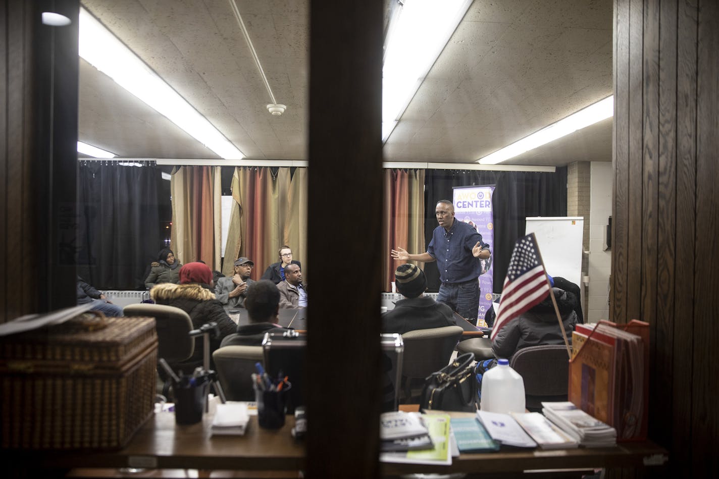 Abdirahman Muse, executive director of Awood Center, leads a meeting of a group that has been discussing working conditions at local Amazon warehouses, in Minneapolis, Nov. 17, 2018. Tied together by a close cultural connection and empowered by a tight labor market, Somali workers appear to be the first known group in the United States to get Amazon management to negotiate. (Jenn Ackerman/The New York Times)