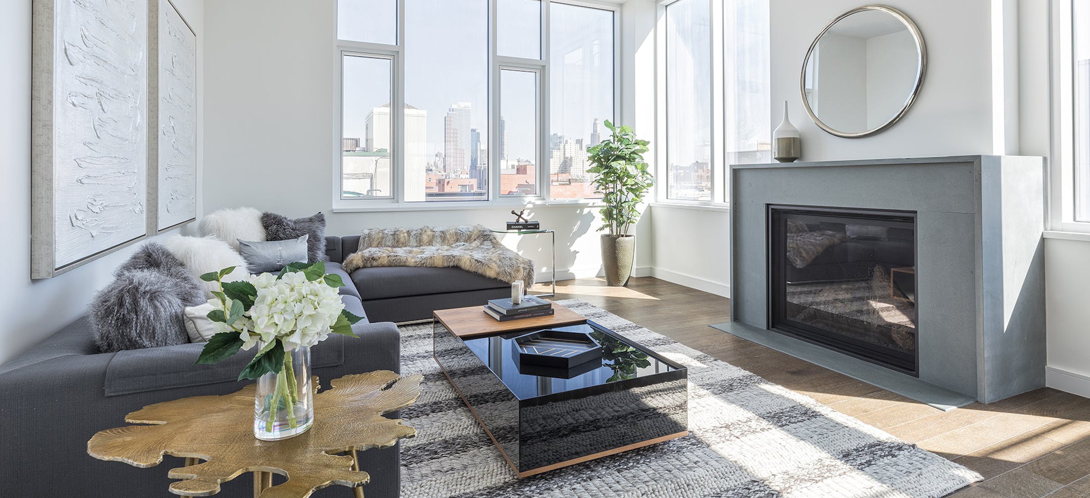 Dark primary furnishings such as a charcoal gray sofa and black coffee table adds a sense of elegance. (Design Recipes/TNS)
