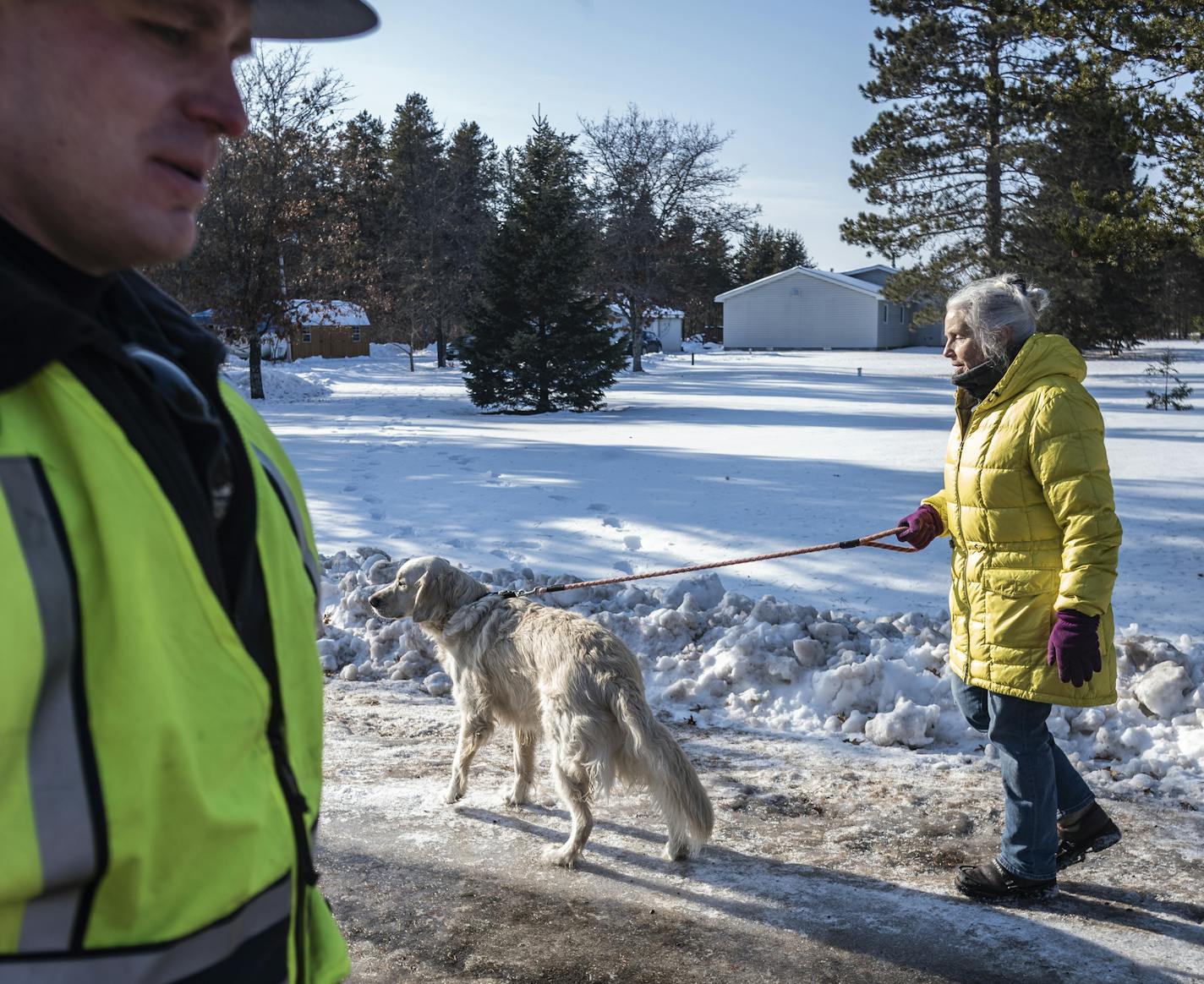 Wisconsin state patrolman Josh Lintula watched as Jeanne Nutter and her dog Nutter headed back to her home near entrance to S Eau Claire Acres Circle at the intersection of HWY Y in Gordon, Wisconsin. Jayme Closs was found about a quarter mile down the road by Nutter.] RICHARD TSONG-TAATARII &#xa5; richard.tsong-taatarii@startribune.com