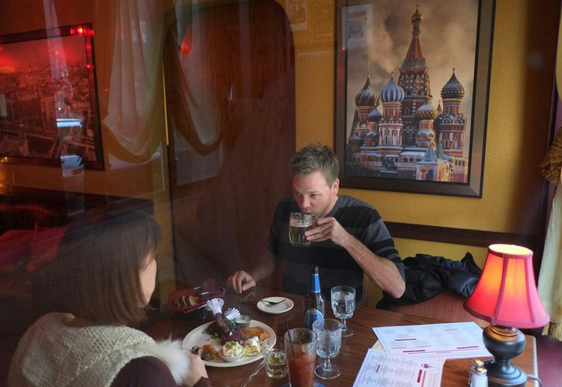 Nathan Hill and Jenni Groyon enjoyrf happy-hour drinks and a sampler plate at Moscow on the Hill