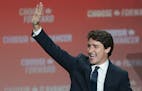 Liberal Leader Justin Trudeau waves to the crowd as he takes the stage in Montreal, on Tuesday, Oct. 22, 2019. (Paul Chiasson/The Canadian Press via A