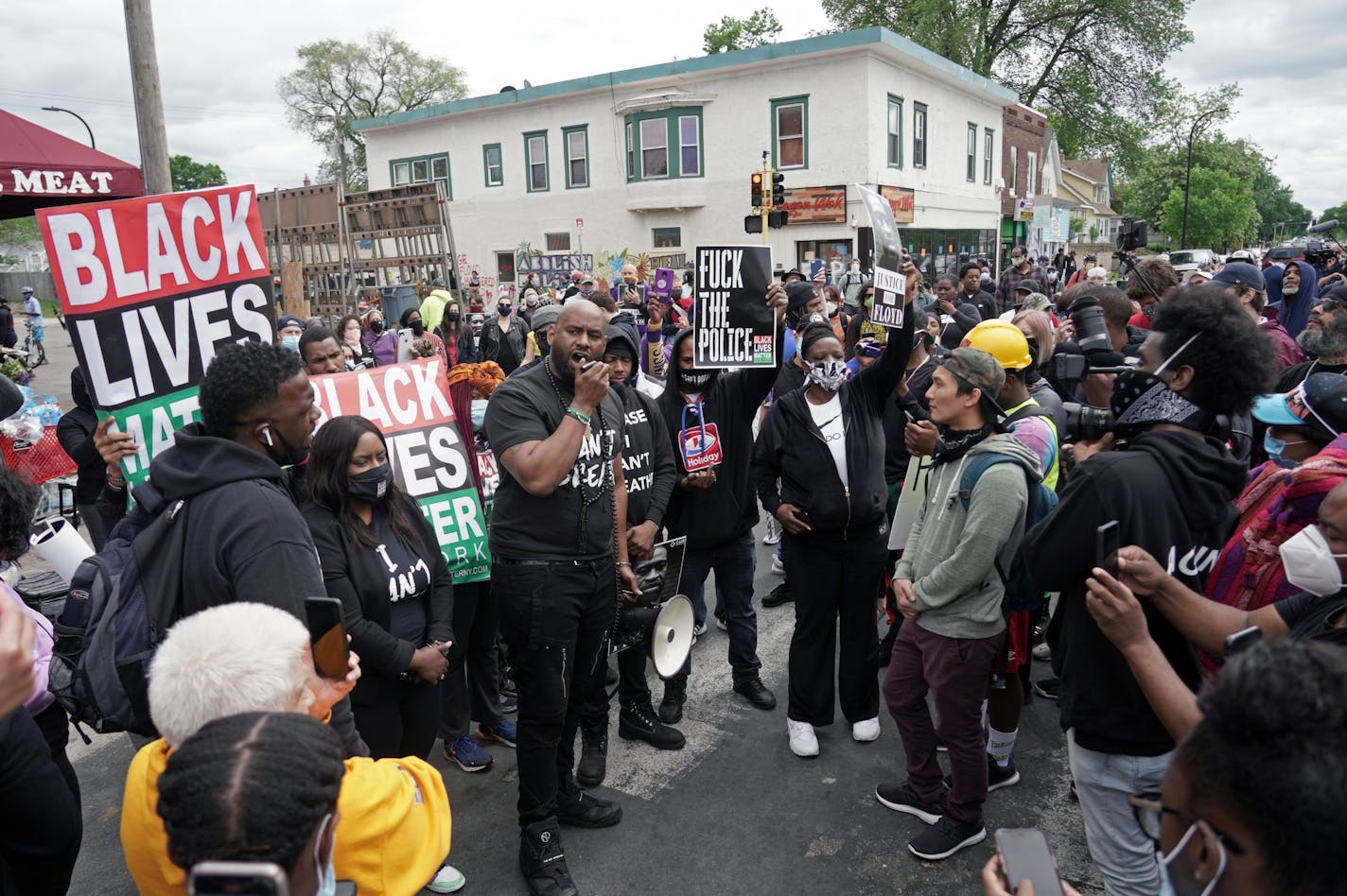 Peaceful protesters, including Actor and comedian Nick Cannon (next to man with megaphone) celebrated the memory of George Floyd and demanded justice outside the Cup Foods store on Chicago Avenue in South Minneapolis where Floyd died at the hands of police.