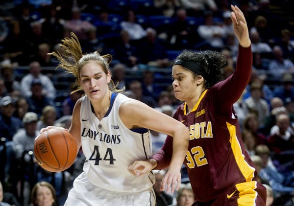 Penn State's Tori Waldner dribbles around Minnesota's Amanda Zahui B. during a women's college basketball game at the Bryce Jordan Center in State Col