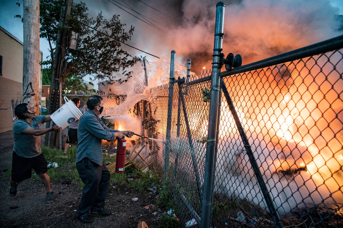 Residents put out a car fire near Lake Street.