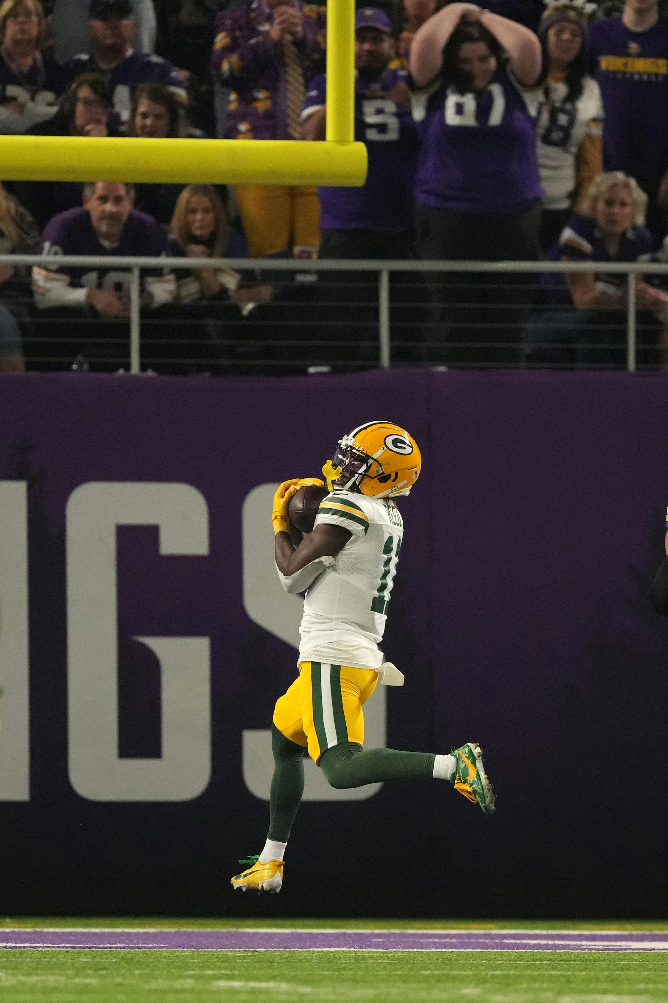Green Bay Packers wide receiver Jayden Reed (11) completes a touchdown pass from quarterback Jordan Love (10) in the first quarter of an NFL game between the Minnesota Vikings and the Green Bay Packers Sunday, Dec. 31, 2023 at U.S. Bank Stadium in Minneapolis. ] ANTHONY SOUFFLE • anthony.souffle@startribune.com