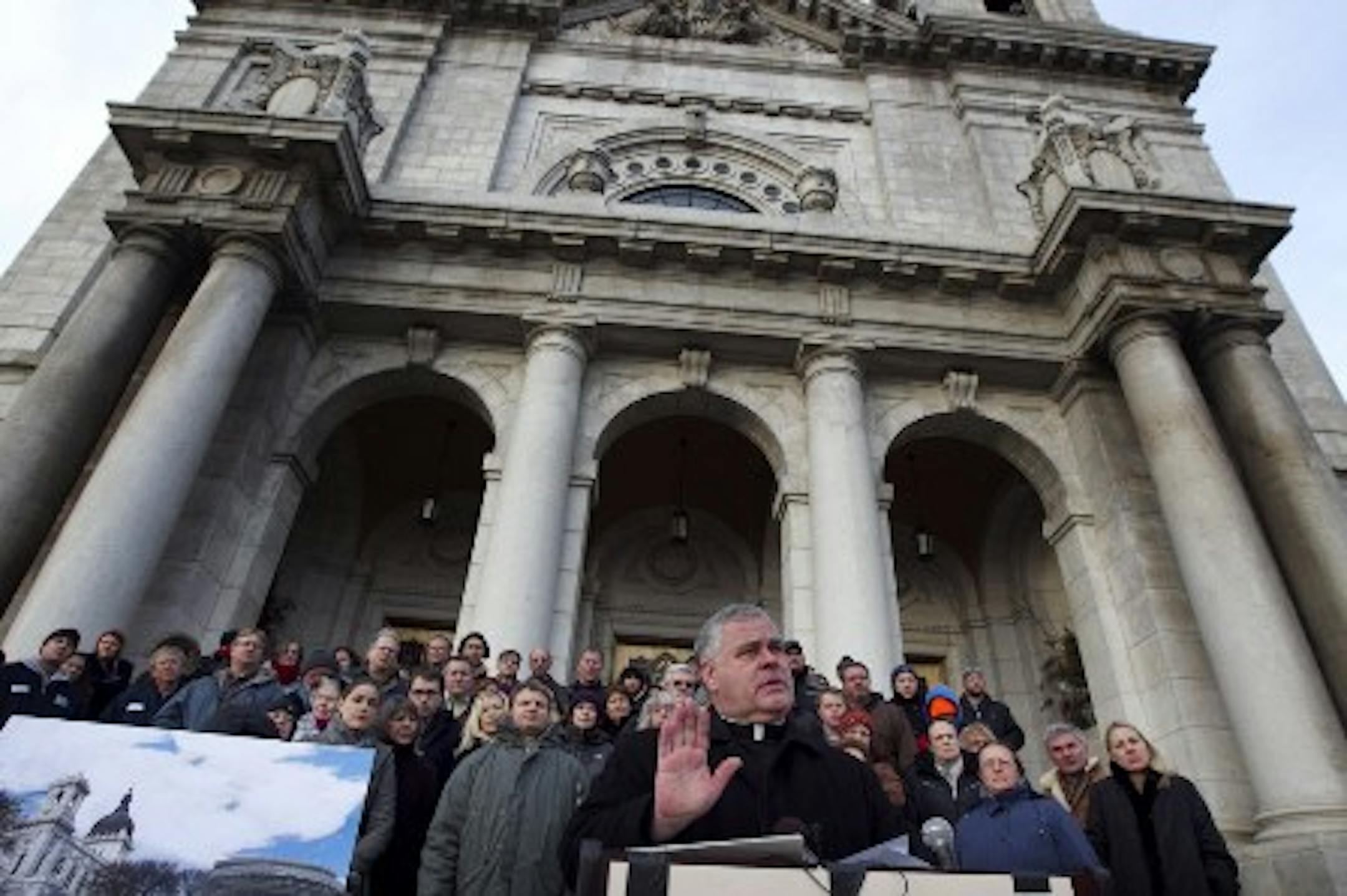 Father John Bauer at the Basilica Wednesday (photo by Jerry Holt)
