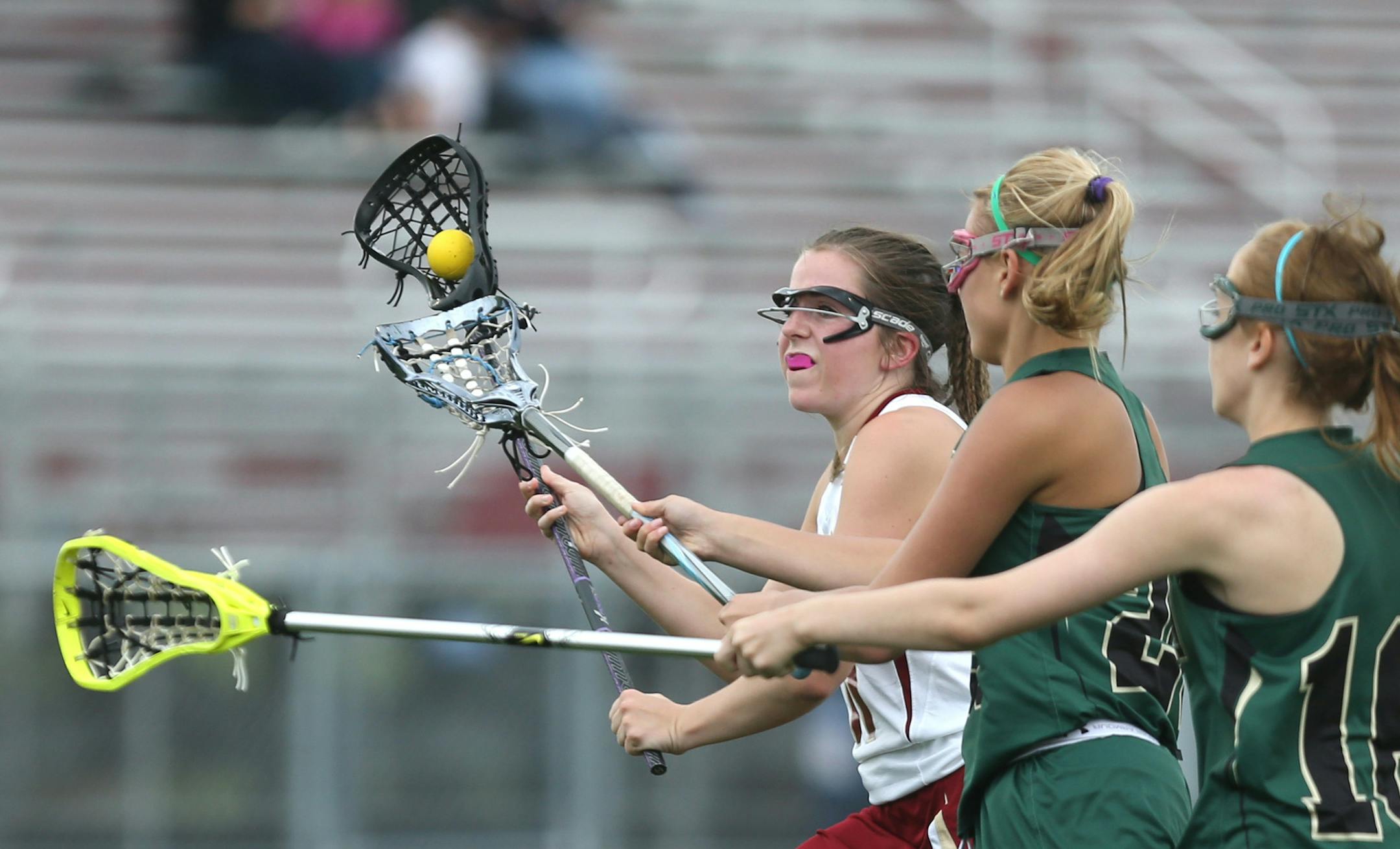 Lakeville South's Maddy Canney scored against the Rochester Mayo defense. ] (KYNDELL HARKNESS/STAR TRIBUNE) kyndell.harkness@startribune.com Lakeville South vs Rochester Mayo in Lakeville Min. Tuesday, May 27, 2014.