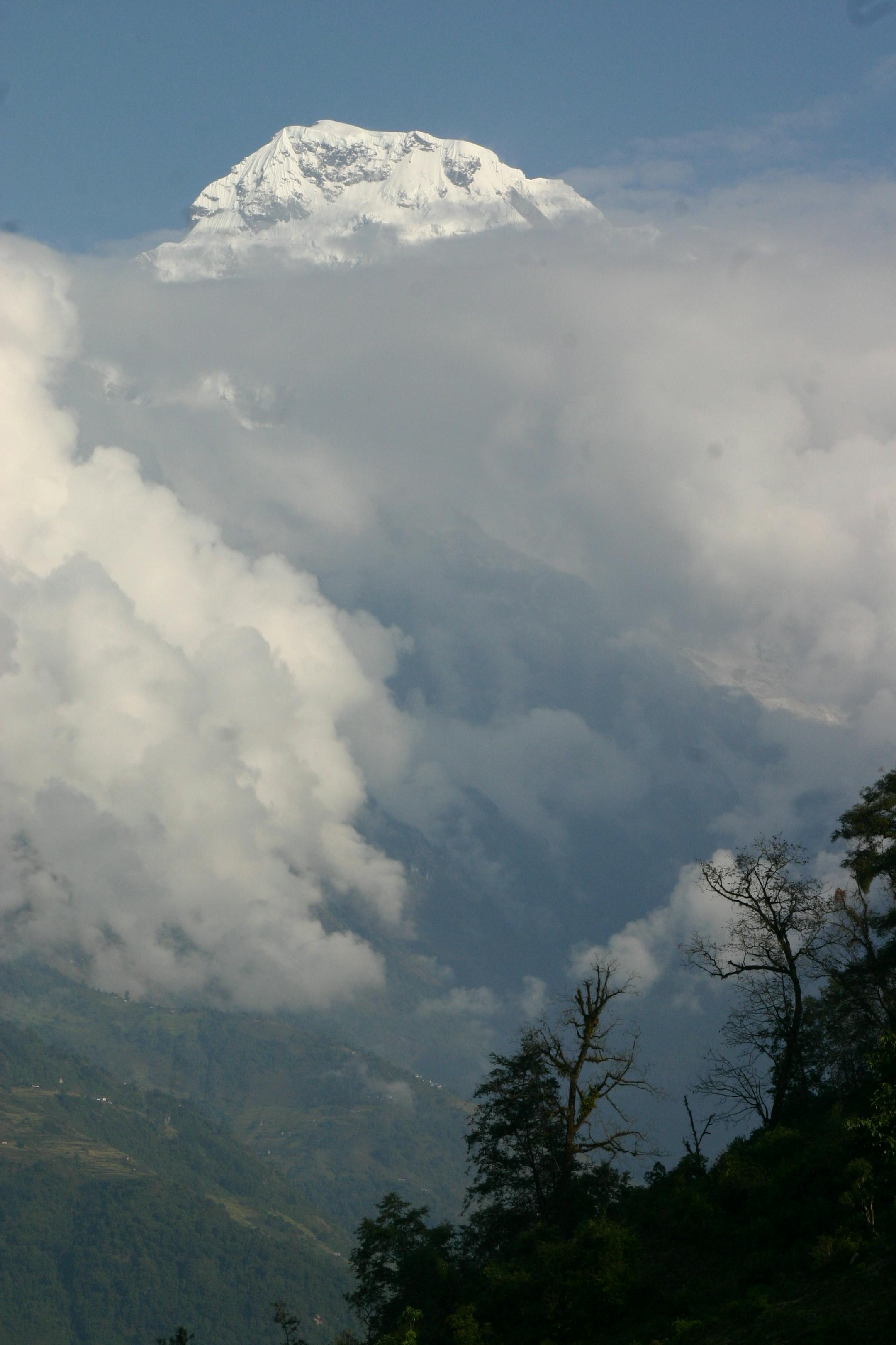 Annapurna South towered above the clouds.