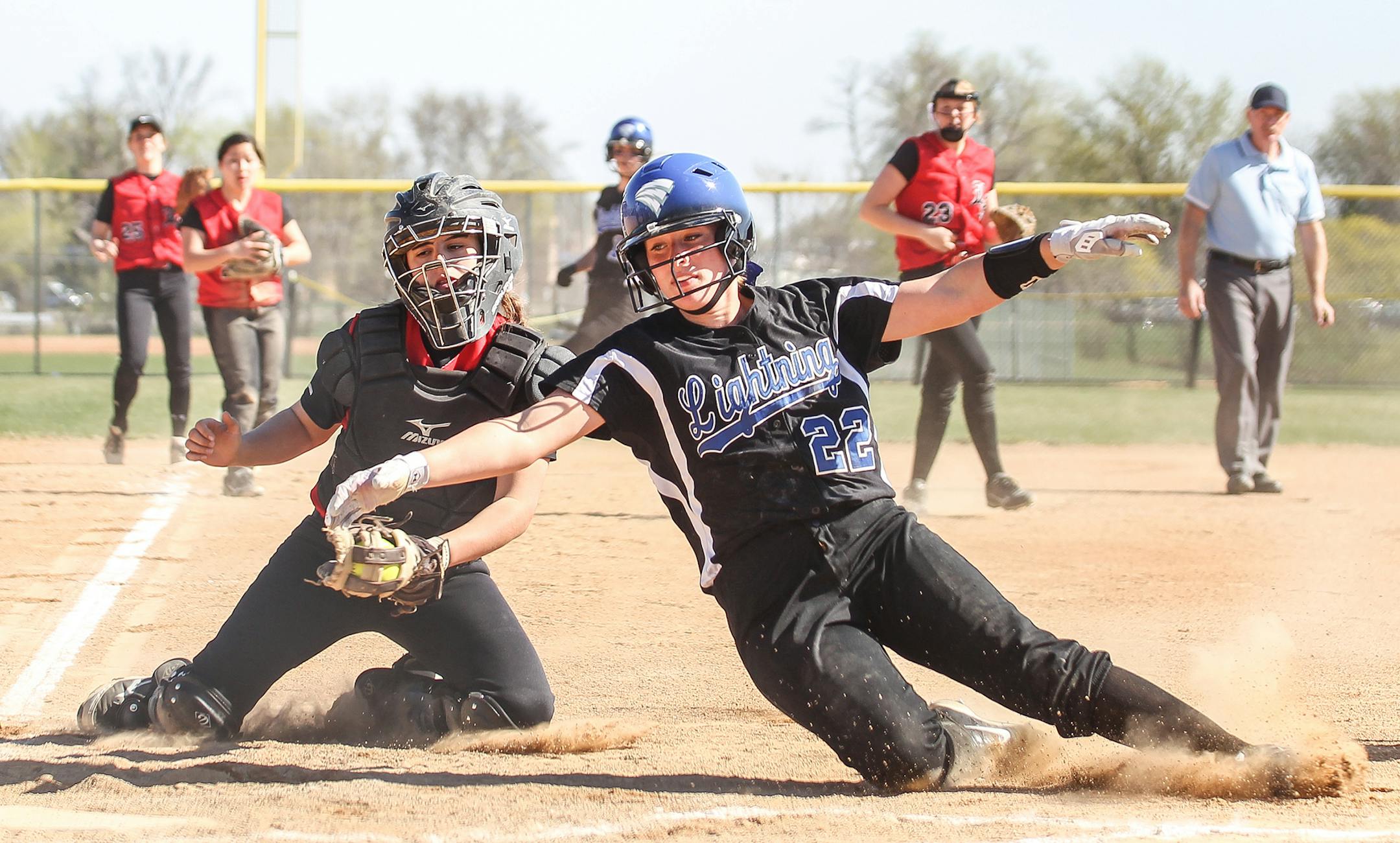 Eastview's Julia Luciano (22) couldn't get around the tag of Lakeville North catcher Amanda Moncelle and was called out at the plate. Eastview did, however, take a 7-0 victory at Lakeville North on Wednesday, April 29. Photo by Mark Hvidsten