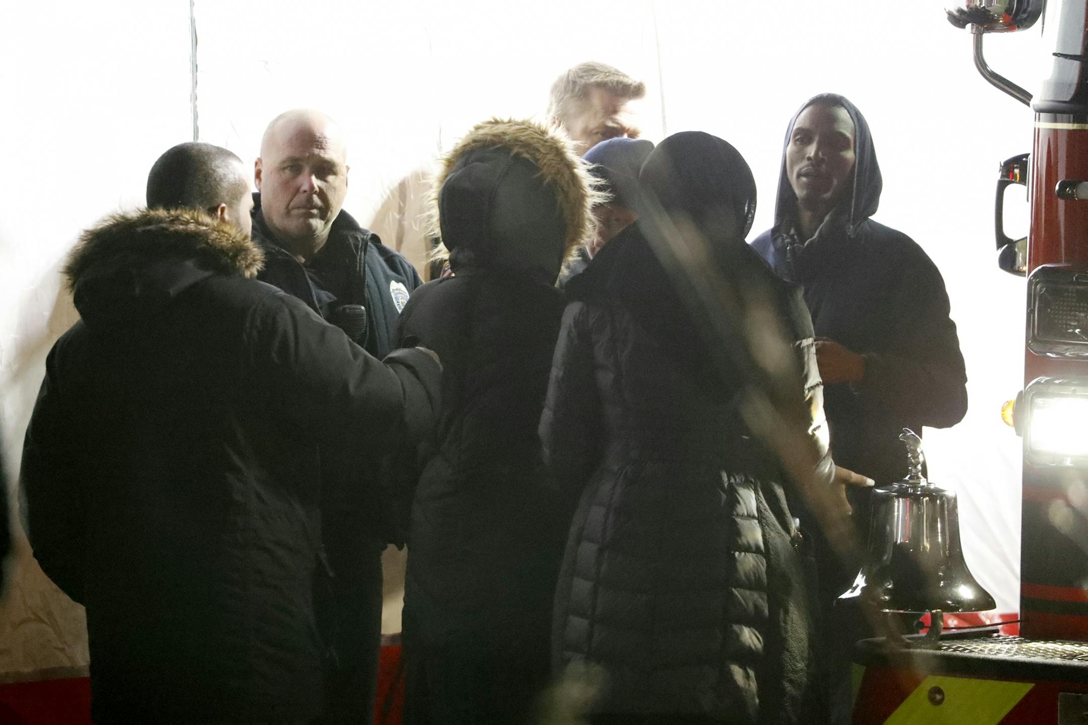 Authorities talk with family members.