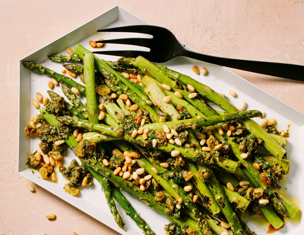 The caper-raisin relish adds a burst of savory-sweet flavor to asparagus. 