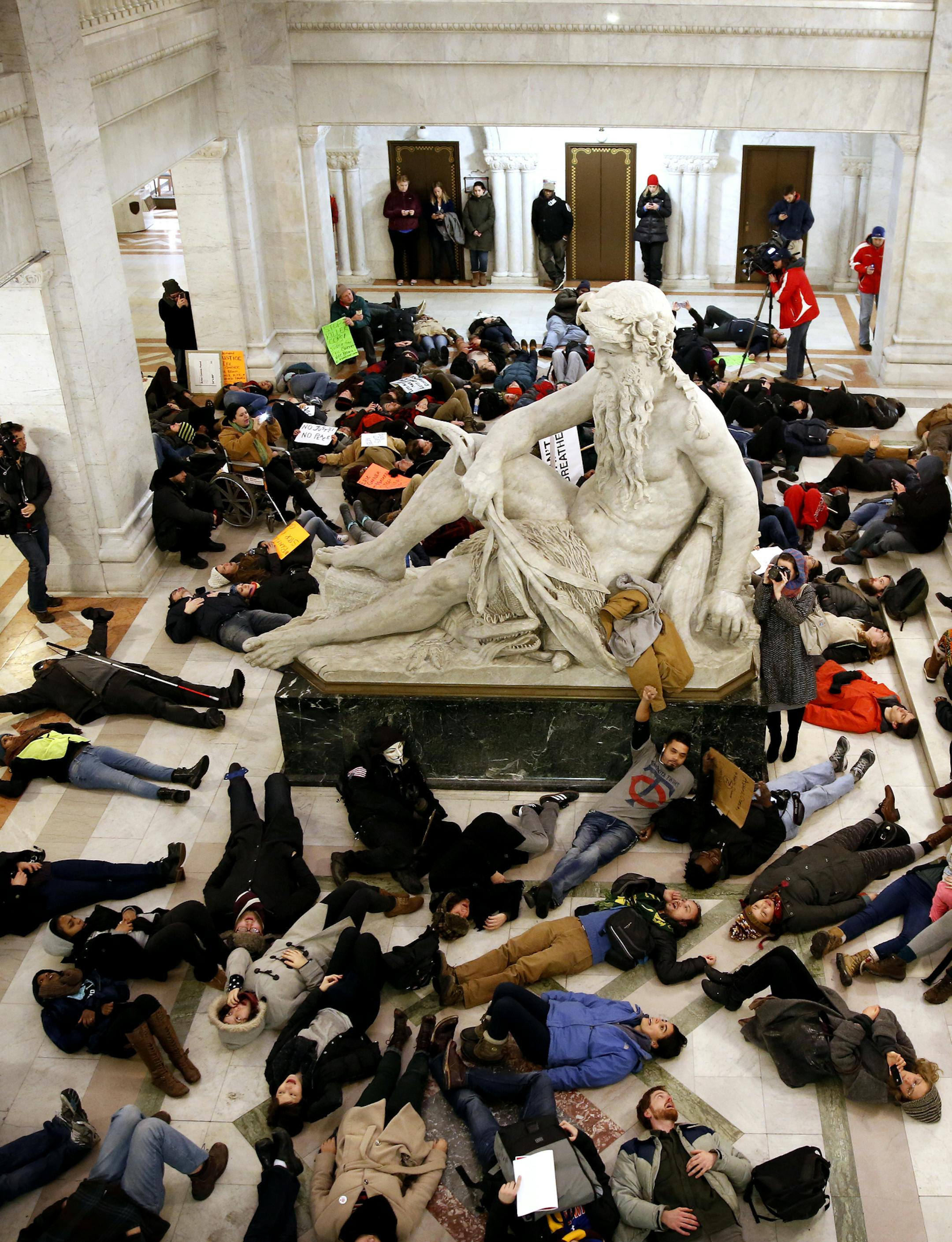 Protesters stage a "die in" during a rally against law enforcement's treatment of minorities at Minneapolis City Hall Thursday, December 4, 2014. ] LEILA NAVIDI leila.navidi@startribune.com /