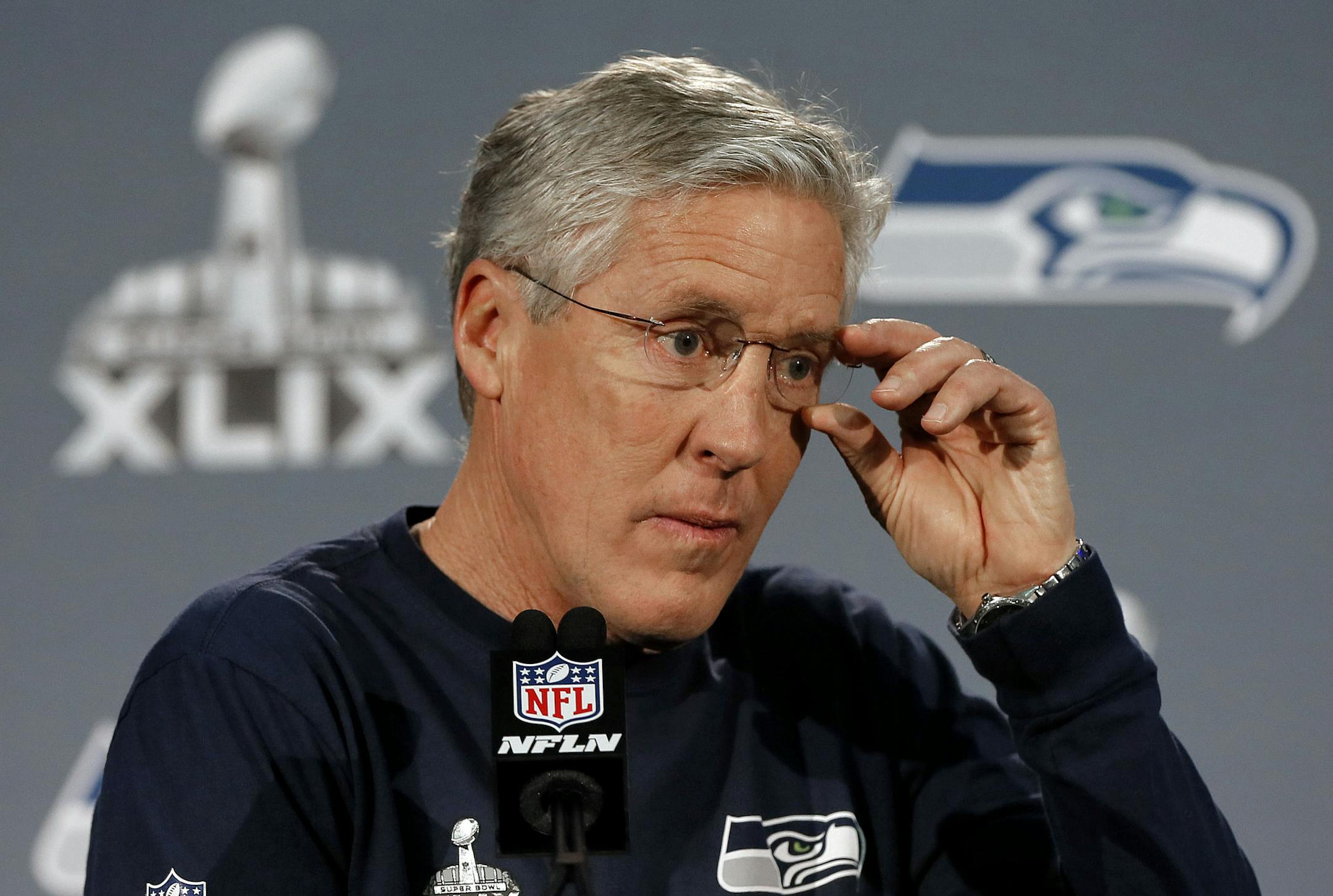 Seattle Seahawks head coach Pete Carroll answers a question during an interview for NFL Super Bowl XLIX football game, Thursday, Jan. 29, 2015, in Phoenix. The Seahawks play the New England Patriots in Super Bowl XLIX on Sunday, Feb. 1, 2015. (AP Photo/Matt York)