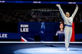 Suni Lee of St. Paul is introduced to the Target Center crowd on the first night of competition in the women's gymnastics U.S. Olympic trials Friday.
