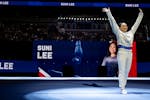 Sunisa “Suni” Lee walks onto the competition floor during the U.S. Gymnastics Olympic Trials at Target Center in Minneapolis on Friday, June 28, 2
