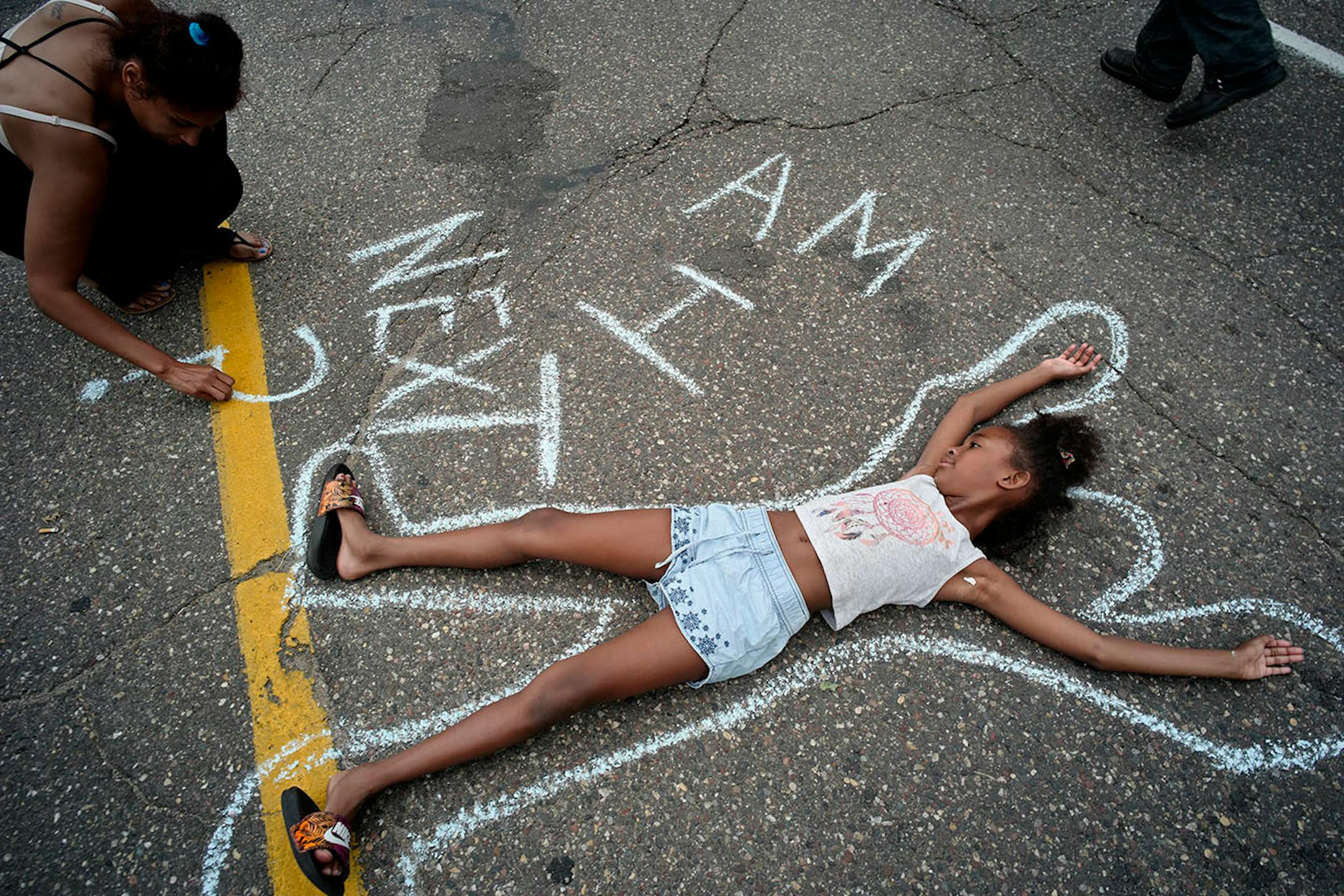 Tia Williamd and her daughter Aissa created a protest on the street.